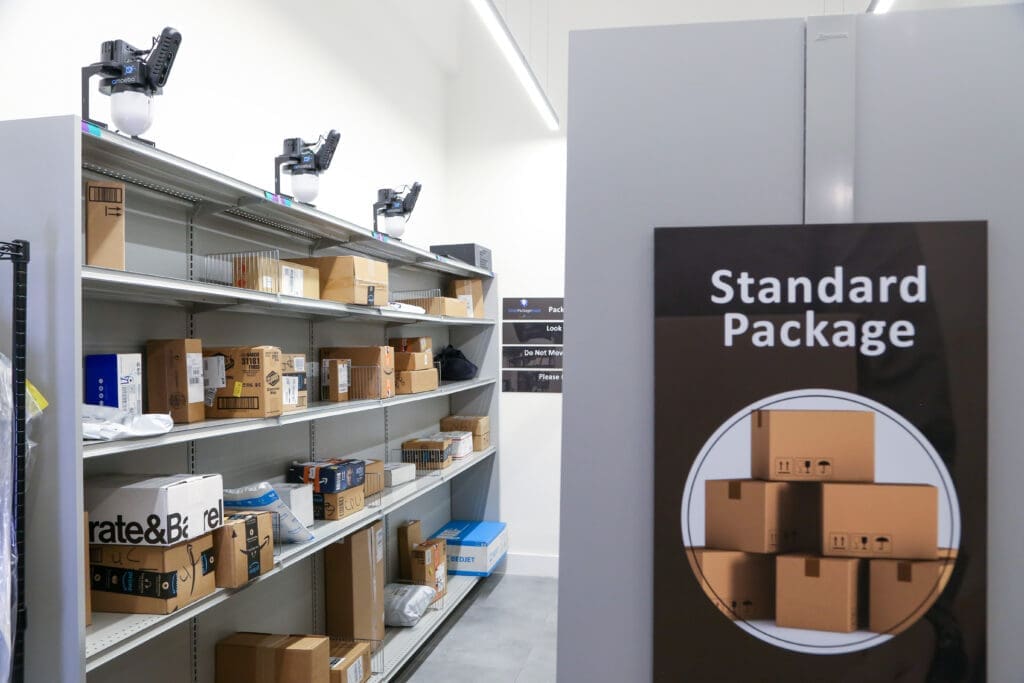 Smart Package Room shelving system labeled Standard Package, showing parcels organized with precision tracking technology for efficient student housing package management.