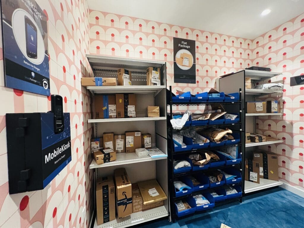 Smart Package Room system with open shelving and precision tracking technology securely storing parcels for students in off-campus housing.