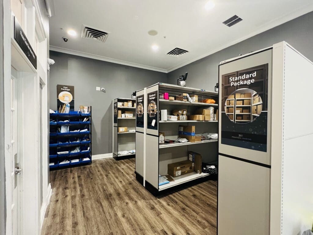 The Smart Package Room system with open shelving for student housing mailrooms, providing scalable and automated package management.