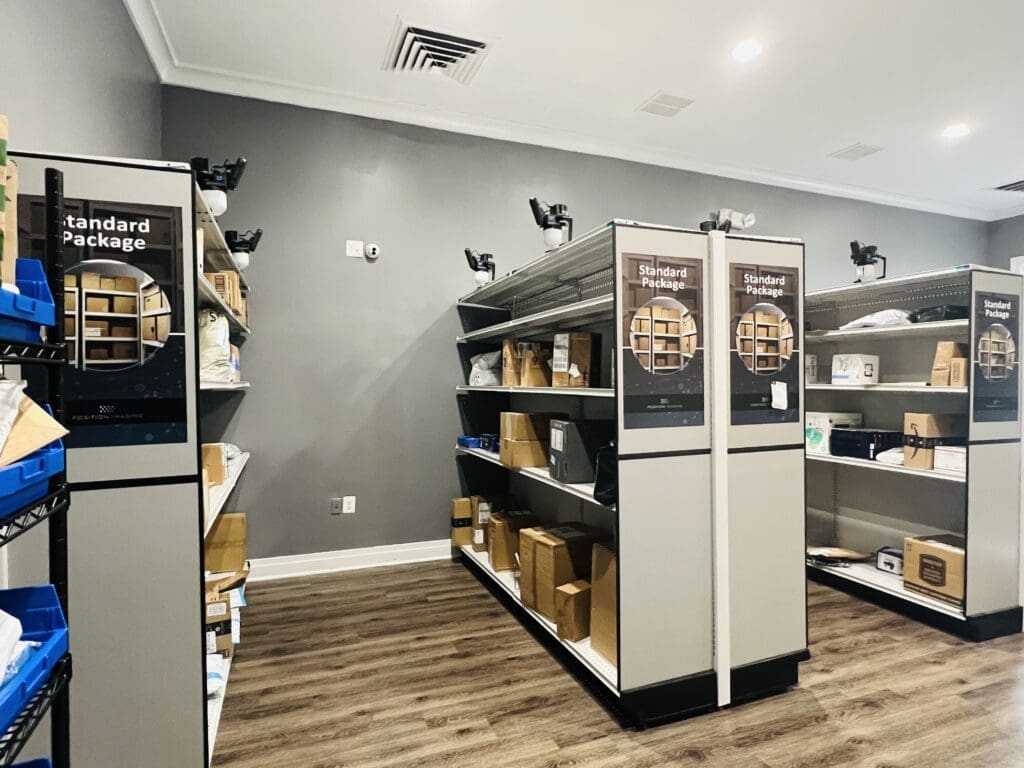 Smart Package Room with organized open shelving and labeled standard package zones, illustrating how to streamline package delivery in residential buildings using an automated package management solution. 